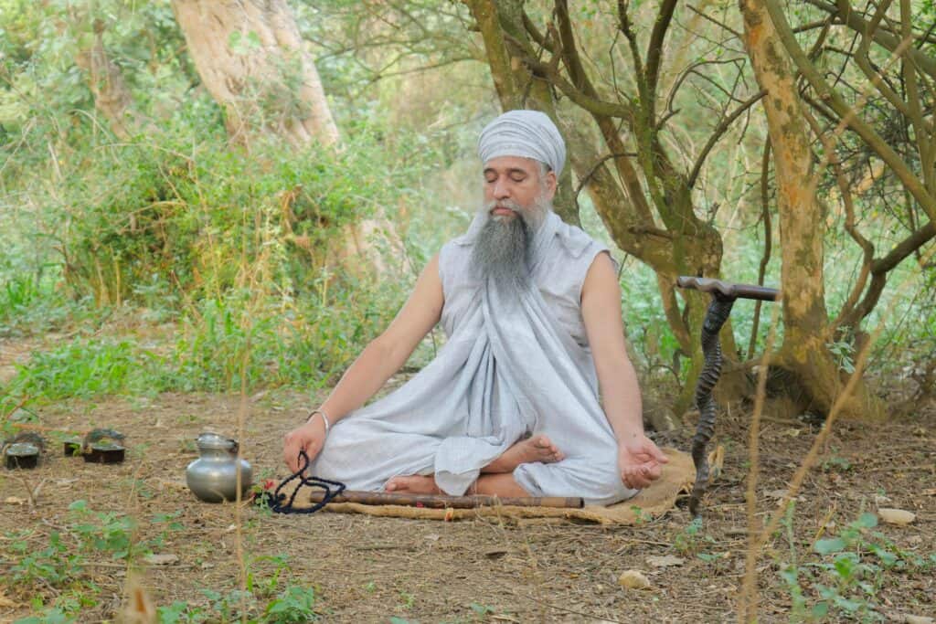 Man practicing mantra meditation for stress relief | Holistic anxiety reduction